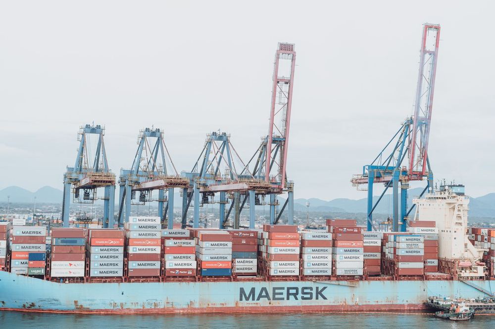 Container ship loading at port for marine spares import and export